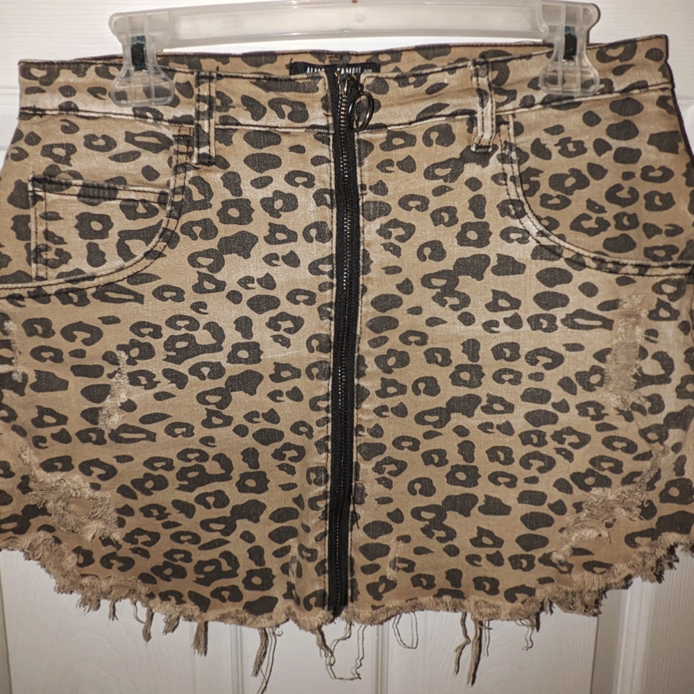 Almost famous leopard skirt ... Holes belong there